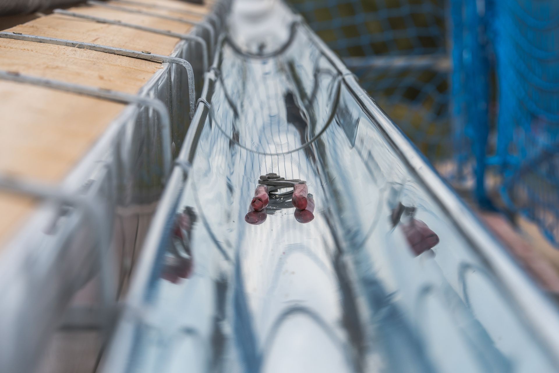 Close-up of a newly installed gutter on a roof. Craftsmanship in tranditional construction.